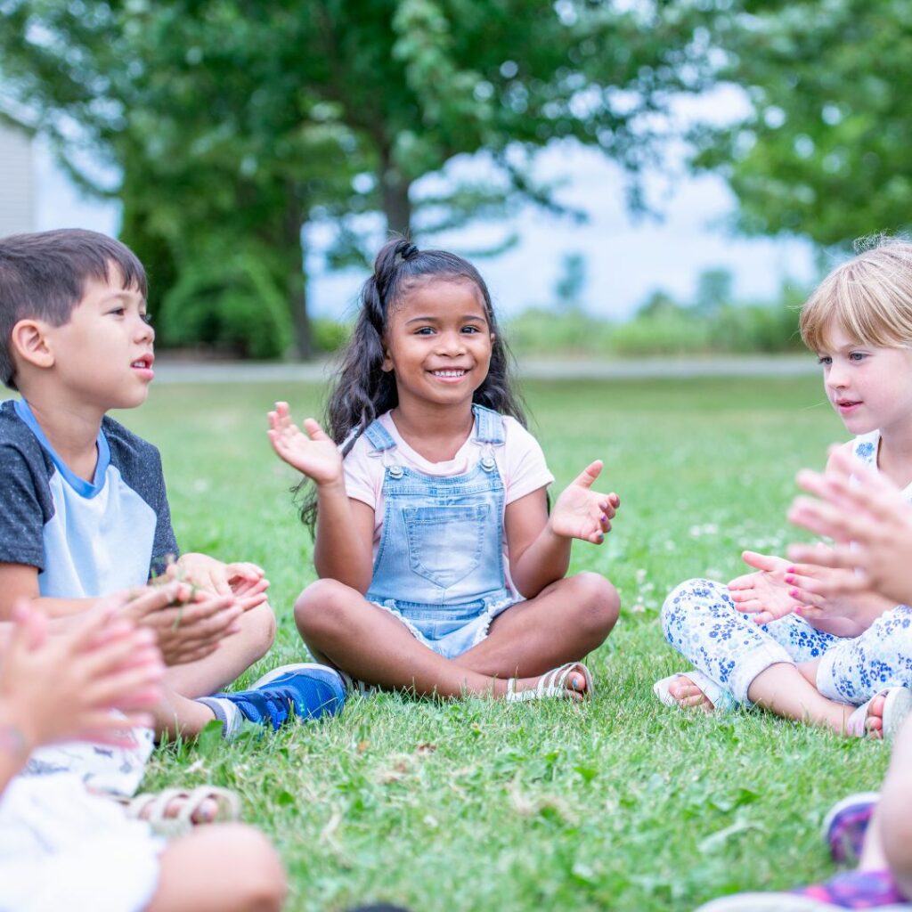 group of kids playing story telling circle review games